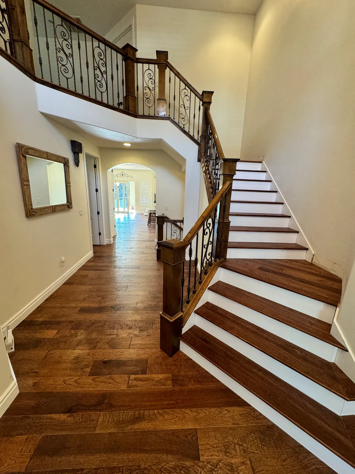 Grand entryway with curved staircase and hardwood, Draper, UT