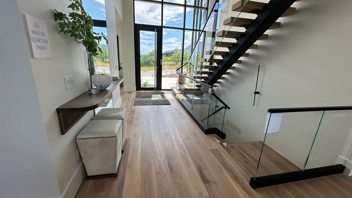 Modern entryway with floating staircase and hardwood floors, Sandy, UT