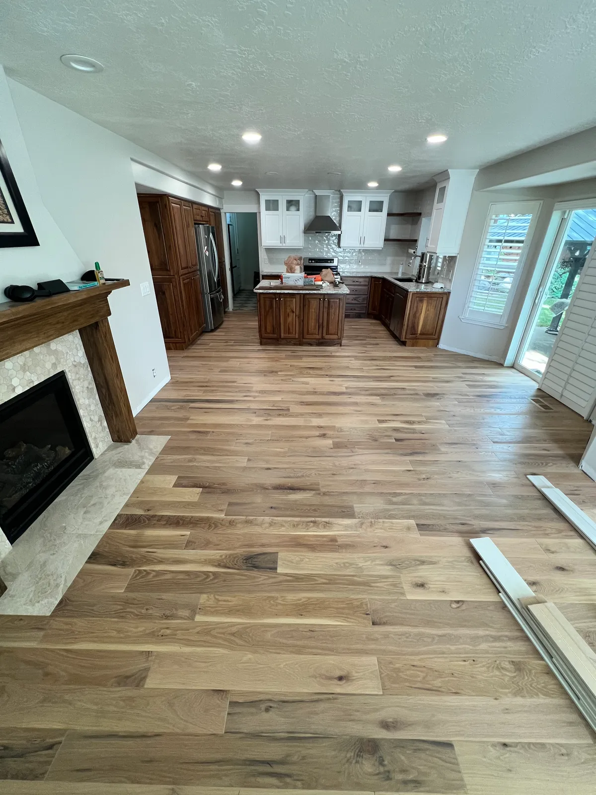 Open plan kitchen with hardwood flooring, West Jordan, UT