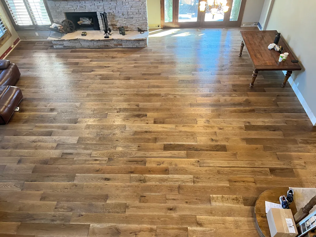 Living room with stone fireplace and hardwood floors, Millcreek, UT