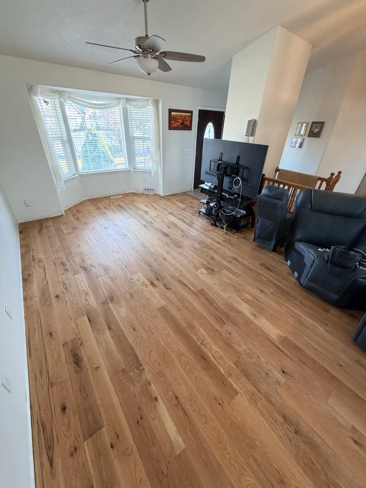 Typical Utah living room with hardwood flooring, American Fork, UT