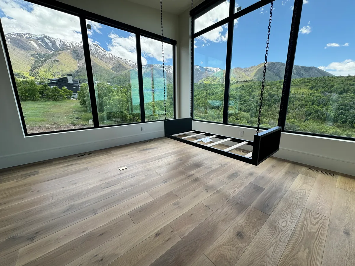 Wide plank hardwood in a mountain room with floor-to-ceiling windows, Alpine, UT